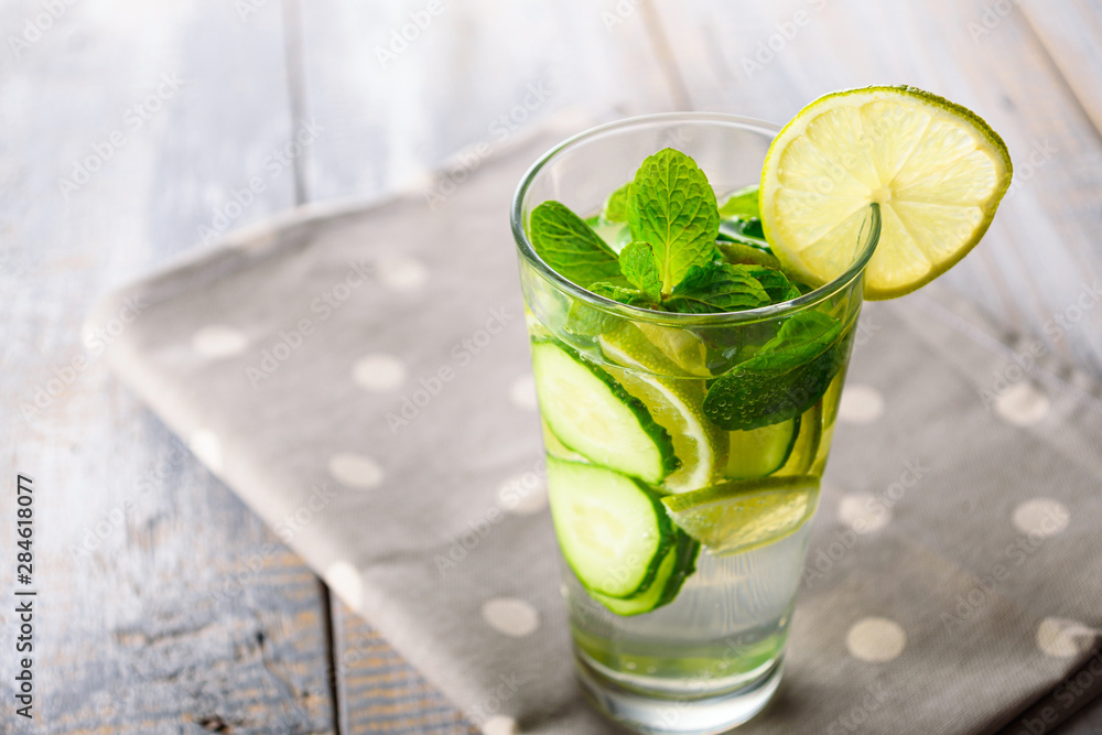 summer lemonade in glass on grey polka dot napkin summer lemonade in glass on grey polka dot napkin