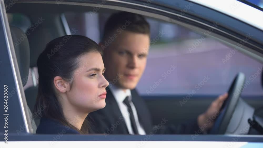 Man trying to hug offended woman, lady leaving car, broken relations, divorce Man trying to hug offended woman, lady leaving car, broken relations, divorce