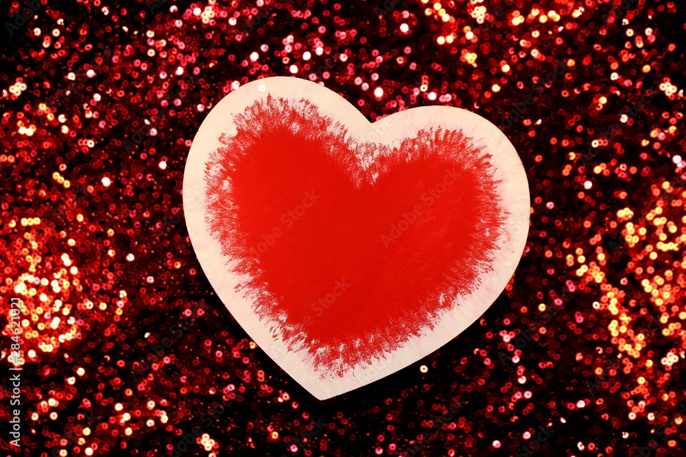 Fototapeta premium beautiful red heart on red shiny background