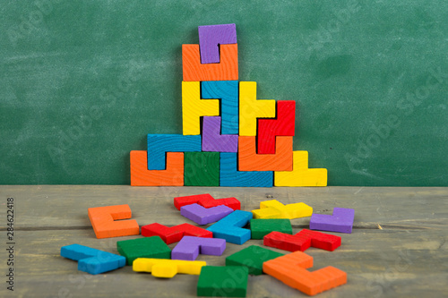 Creative solution for idea - business concept, jigsaw puzzle on the blackboard