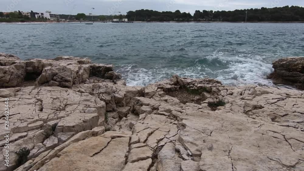 seascape view of rocky beach at stormy weather slow motion seascape view of rocky beach at stormy weather slow motion