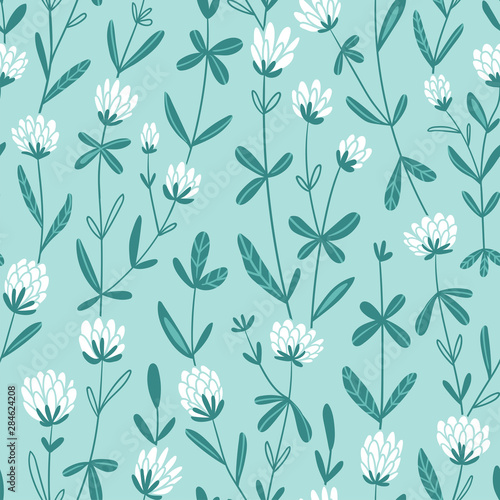White clover flowers. Vector floral seamless pattern. Cute hand-drawn pattern design for fabric, wallpaper or wrap paper.