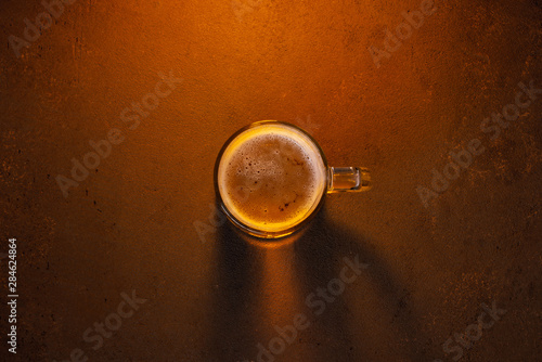 Beer mug on the brown textured table