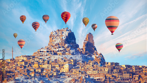 Hot air balloon flying over spectacular Cappadocia with Uchisar catle
