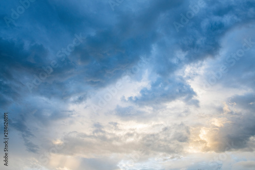 Beautiful sun ray light through down from cloud after rain. Natural landscape, blue sky when sunset time - Image