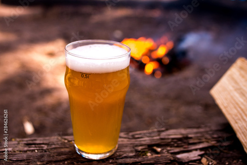 glass of beer on wooden table