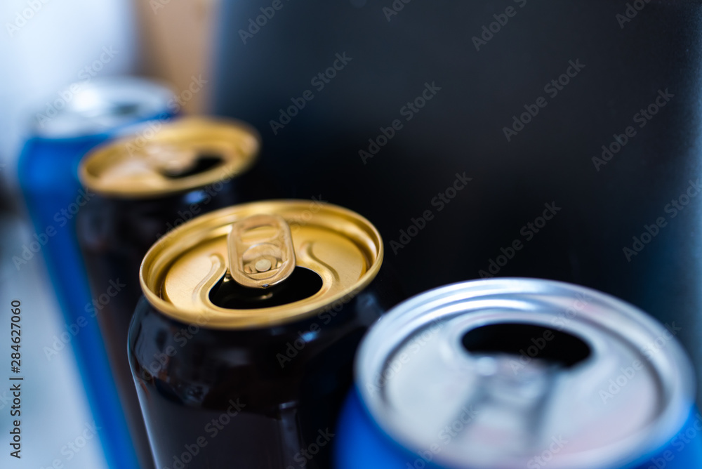 three beer cans on an abstract background three beer cans on an abstract background