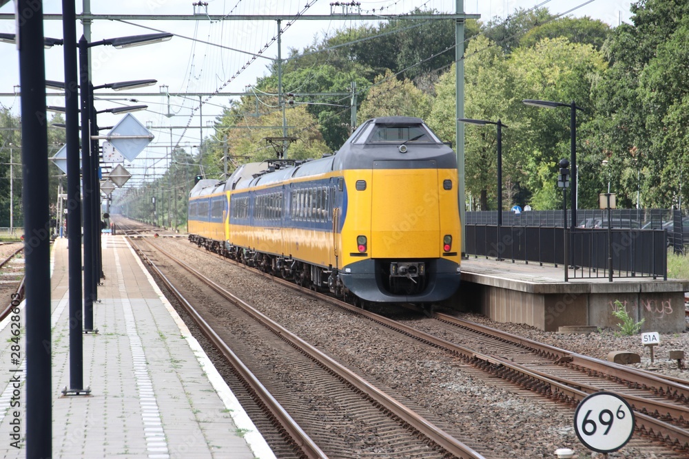 ICM koploper intercity on track at station 't Harde in the Netherlands