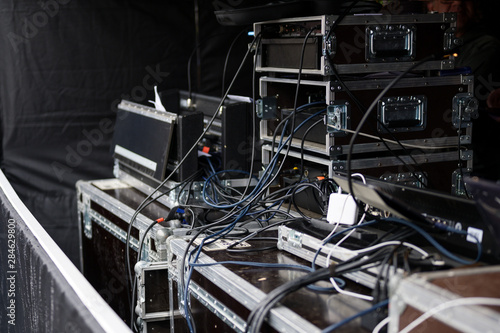 cases and racks from a sound amplification system for an event on an open-air stage photo