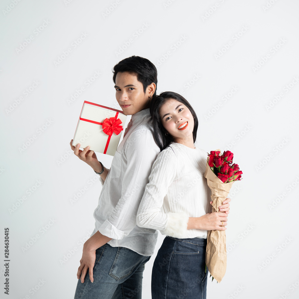 valentines day, love and people concept - happy couple with red heart shaped balloons, Roses, Big Red heart Paper over white background valentines day, love and people concept - happy couple with red heart shaped balloons, Roses, Big Red heart Paper over white background