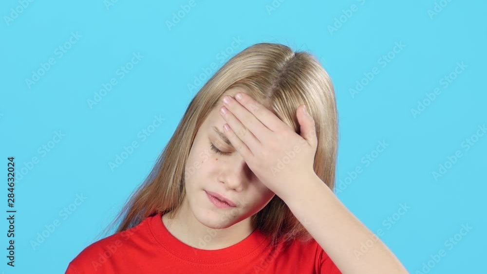 Close-up little girl show us painful emotion. She is ill. Slow motion Close-up little girl show us painful emotion. She is ill. Slow motion