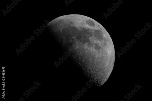  I took a picture of the first quarter moon using pentax 500mm+canon x2 converter. You can see the craters on the moon' surface. photo