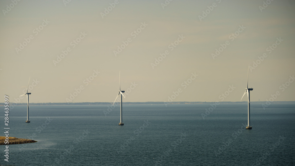 wind turbines farm on coast