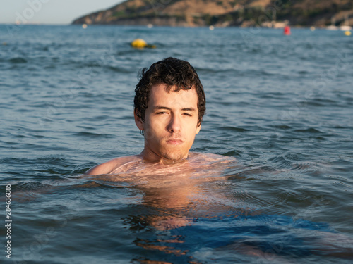 Young man relaxing and refreshing in the ocean © Algecireño