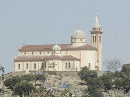 Eritrea, Africa - 05/10/2019: Travelling around the vilages near Asmara and Massawa. An amazing caption of the trees, mountains and some old typical houses with very hot climate in Eritrea.