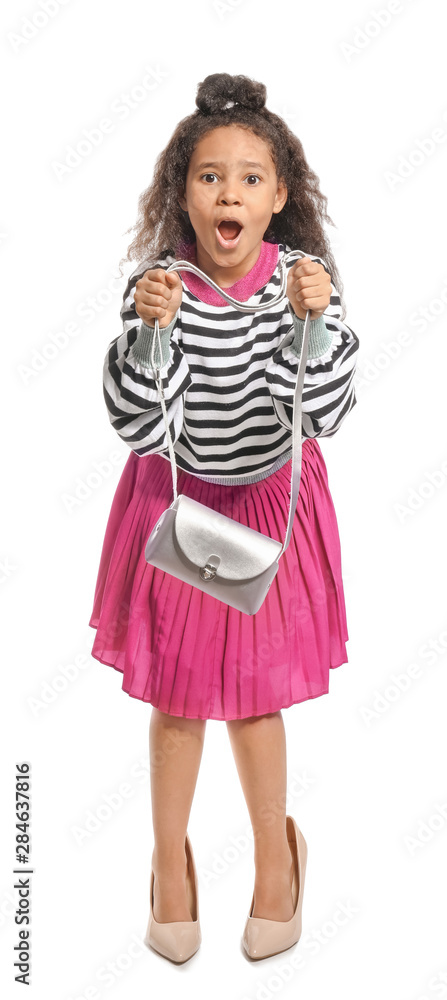 Fashionable African-American girl in mother's shoes on white background Fashionable African-American girl in mother's shoes on white background