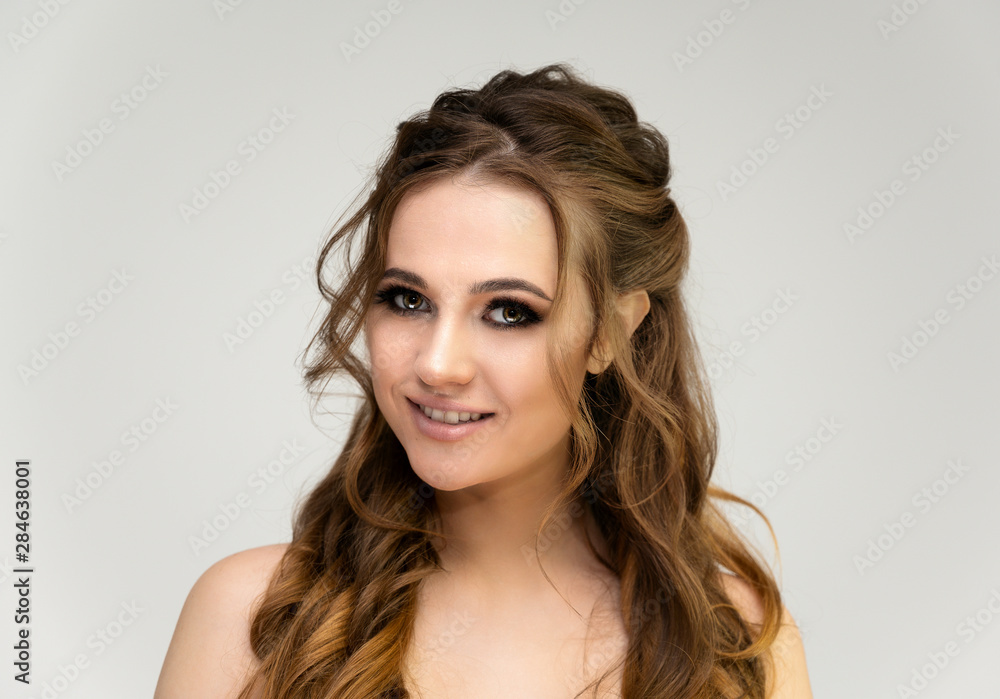 Beauty portrait of a beautiful girl with excellent makeup and good face skin and a wonderful hairstyle Beauty portrait of a beautiful girl with excellent makeup and good face skin and a wonderful hairstyle