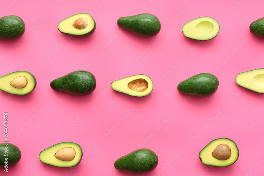 Fresh avocados on color background