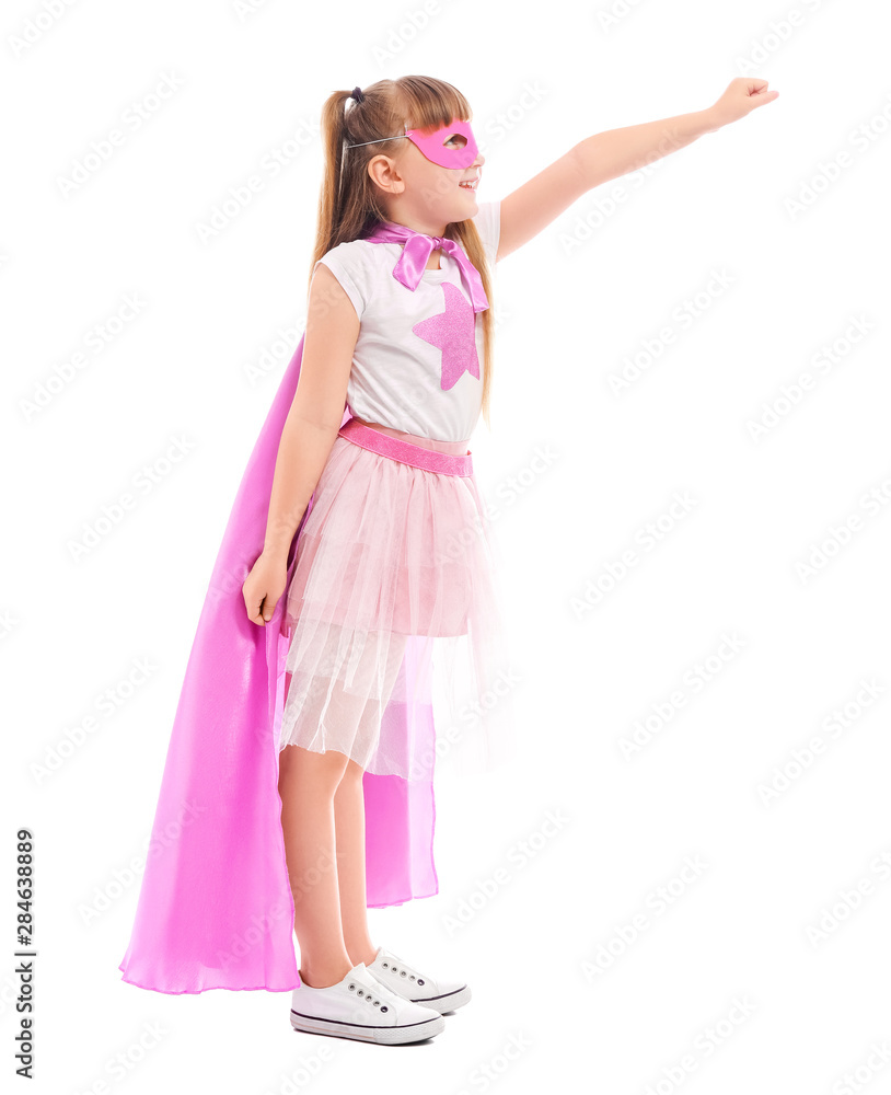 Cute little girl dressed as superhero on white background