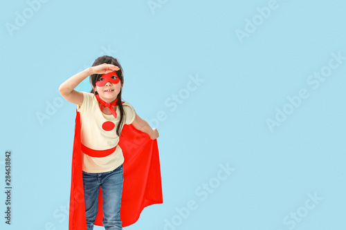 Cute little girl dressed as...