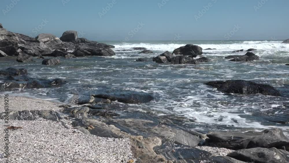 The waves of the Atlantic Ocean break on coastal cliffs. The waves of the Atlantic Ocean break on coastal cliffs.