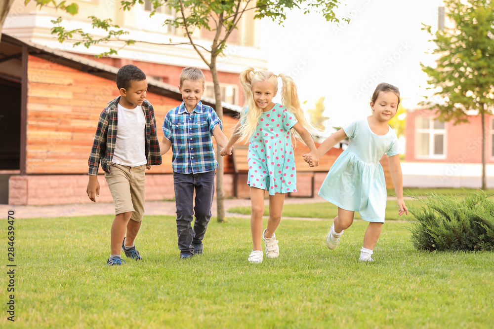 Fototapeta premium Cute little children running in park