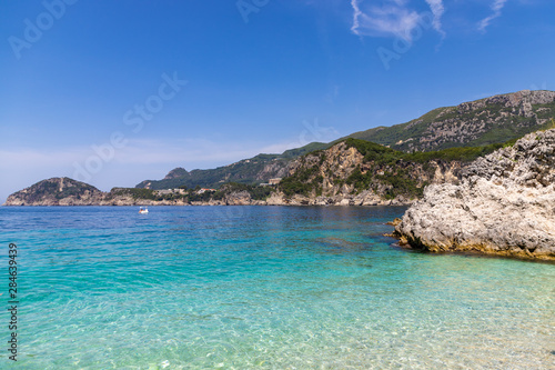 Fototapeta Naklejka Na Ścianę i Meble -  Rovinia beach in Liapades. One of greek island Corfu natural beach view with crystal clear water. Corfu, Greece.