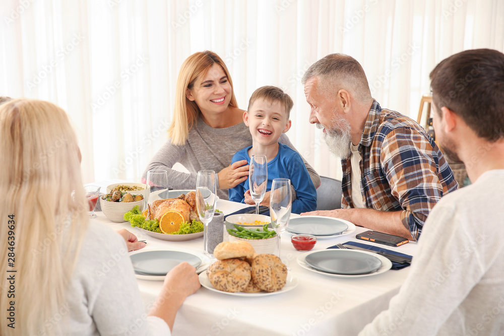 Happy family having Christmas dinner at home Happy family having Christmas dinner at home