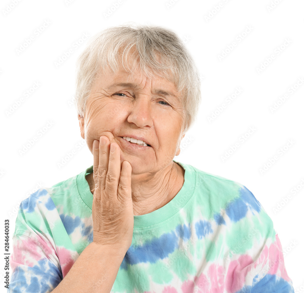 Senior woman suffering from toothache against white background Senior woman suffering from toothache against white background
