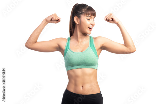 Fitness woman white background. Asian woman. Showing arm muscle, looking at her arm.