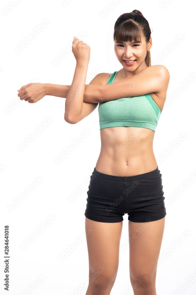 Fitness woman warming up isolated on white background. Asian lady. Arm stretch, happy smile. Fitness woman warming up isolated on white background. Asian lady. Arm stretch, happy smile.
