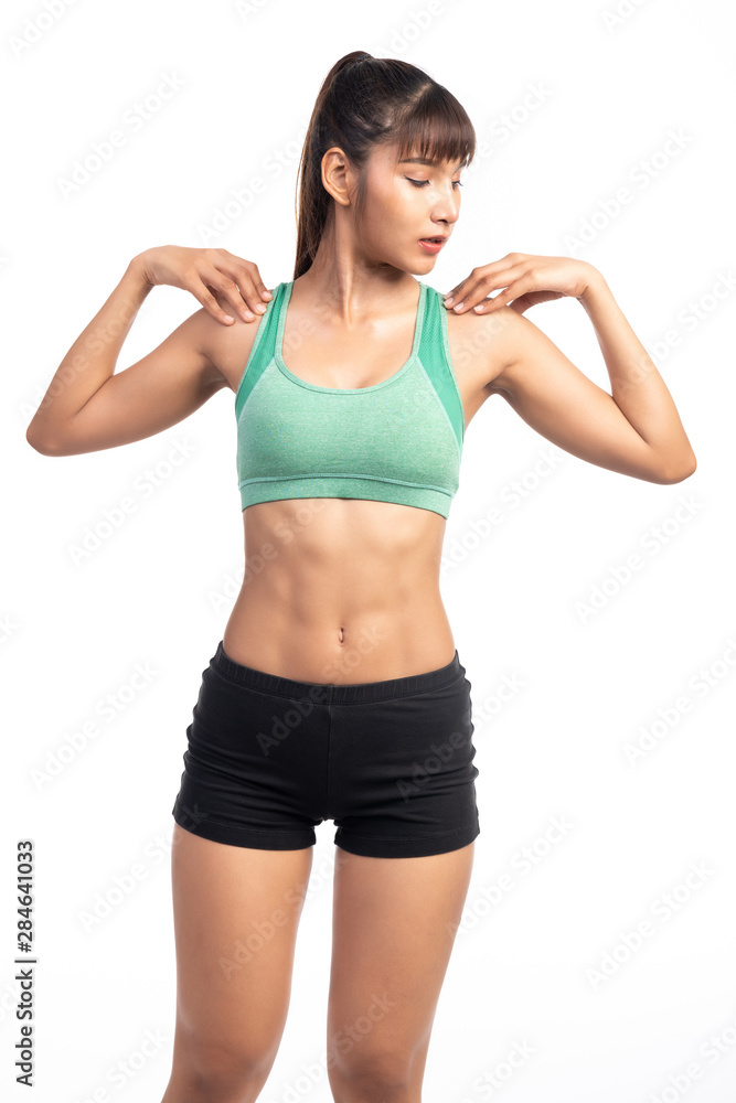 Fitness woman warming up isolated on white background. Asian lady. Shoulder stretch. Fitness woman warming up isolated on white background. Asian lady. Shoulder stretch.