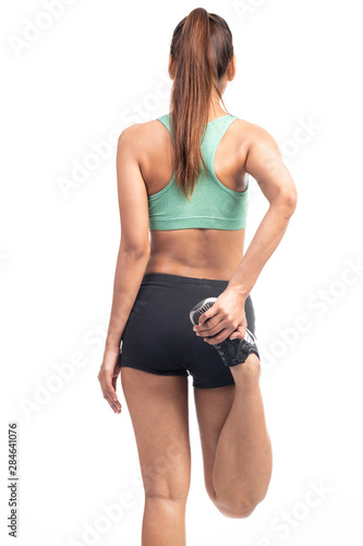 Fitness woman warming up isolated on white background. Asian lady. Knee stretch, happy smile, back shot.