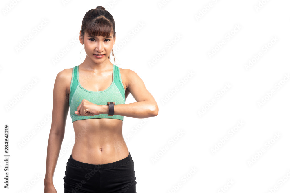 Fitness woman using smart watch isolated in white background. Asian girl, lookng at her watch with happy smile. Fitness woman using smart watch isolated in white background. Asian girl, lookng at her watch with happy smile.
