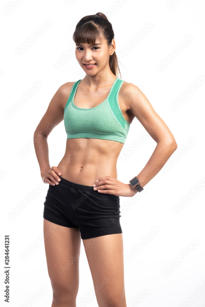 Fitness woman wearing smart watch isolated in white background. Asian girl, happy smile pose.