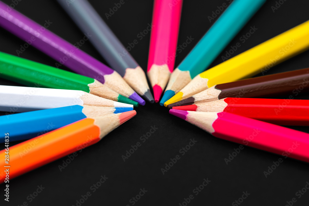 Colored pencils isolated on black background. Close up Colored pencils isolated on black background. Close up