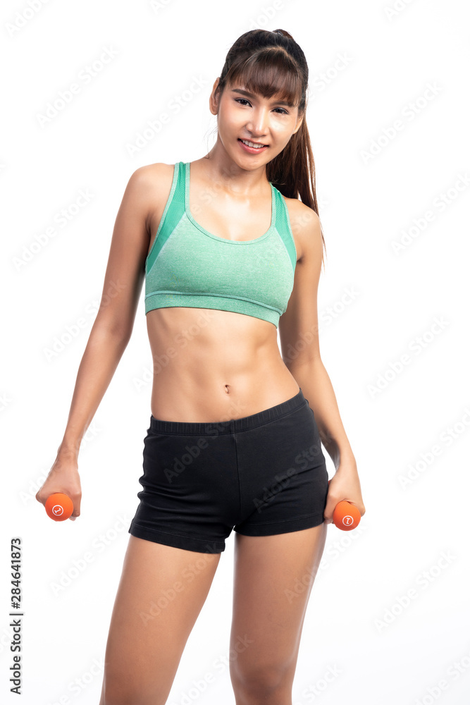 Fitness woman holding dumbbells isolated in white background. Asian girl, happy smile. Fitness woman holding dumbbells isolated in white background. Asian girl, happy smile.