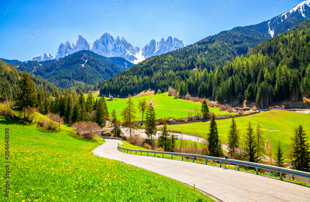 Alpine road with a beautiful view in Santa Maddalena village, Dolomites, Italy.