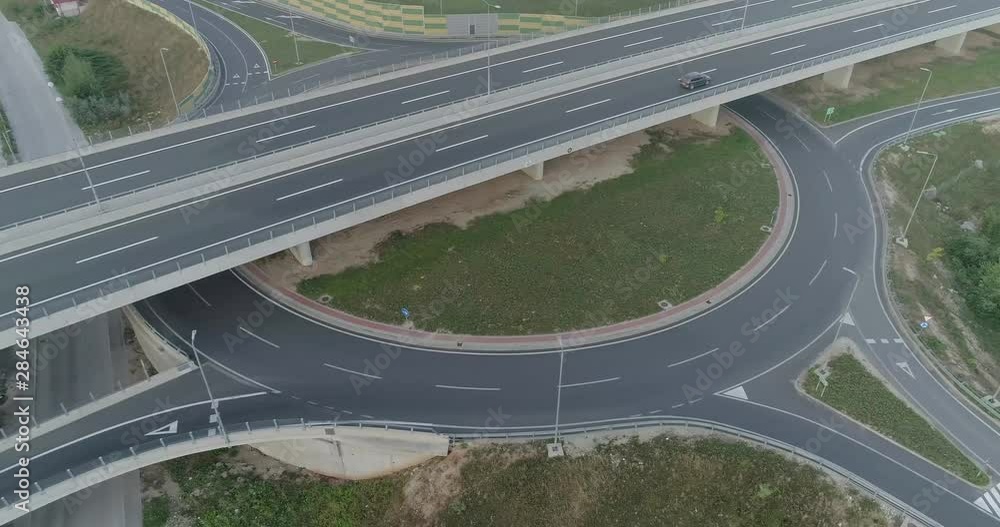 Aerial view of highway and overpass in city. Aerial view roundabout interchange of a city. Expressway is an important infrastructure. Aerial view of highway and overpass in city. Aerial view roundabout interchange of a city. Expressway is an important infrastructure.