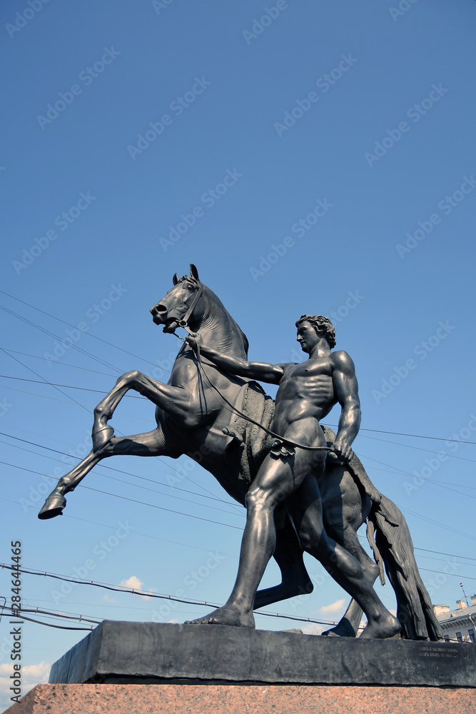 Horse tamers monument on Anichkov Bridge in Saint-Petersburg Russia. Popular touristic landmark.