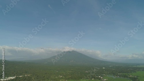 Aerial view mountain valley with hills covered forest, trees, mount Iriga. Luzon, Philippines. Slopes of mountains with evergreen vegetation. Mountainous tropical landscape. photo