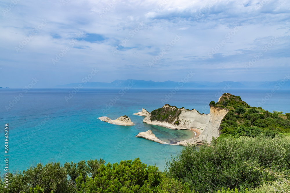 Cape Drastis, the impressive formations of the ground, rocks and the blue waters panorama, Corfu, Greece, Ionian Islands.