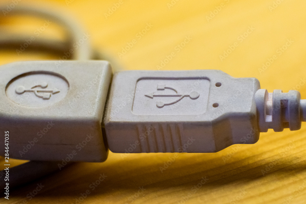 Two white USB socket port on wire with USB sign Two white USB socket port on wire with USB sign