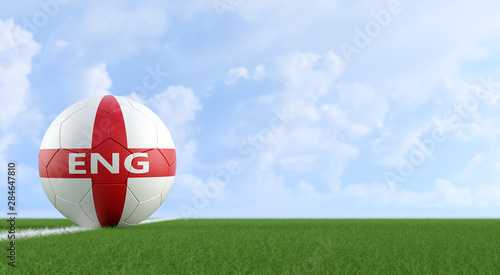 Soccer ball in english national colors on a soccer field. Copy space on the right side - 3D Rendering 