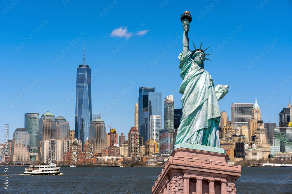 The Statue of Liberty over the Scene of New york cityscape river side which location is lower manhattan,Architecture and building with tourist concept