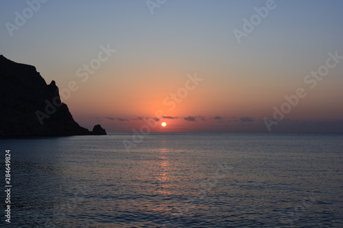 sunrise over sea  and silhouette of Cabo de San Antonio  Javea  Spain