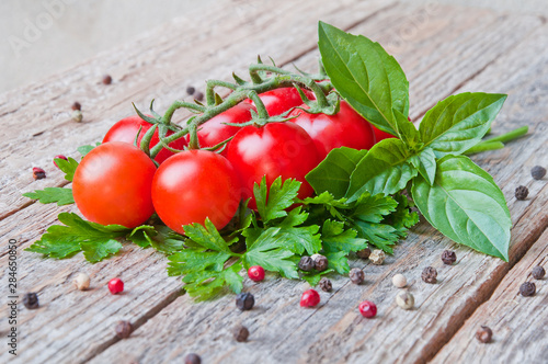 Fresh cherry tomatoes on old wooden table