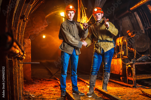 Two miners in the mine