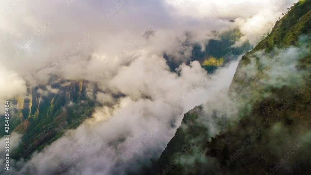 Aerial shot of the cliff mountain and the sea in Na Pali coast in Kauai Hawaii Aerial shot of the cliff mountain and the sea in Na Pali coast in Kauai Hawaii