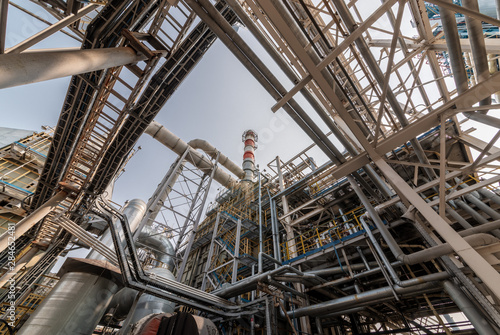 low angle view of metal pipes of industrial plant outdoor 